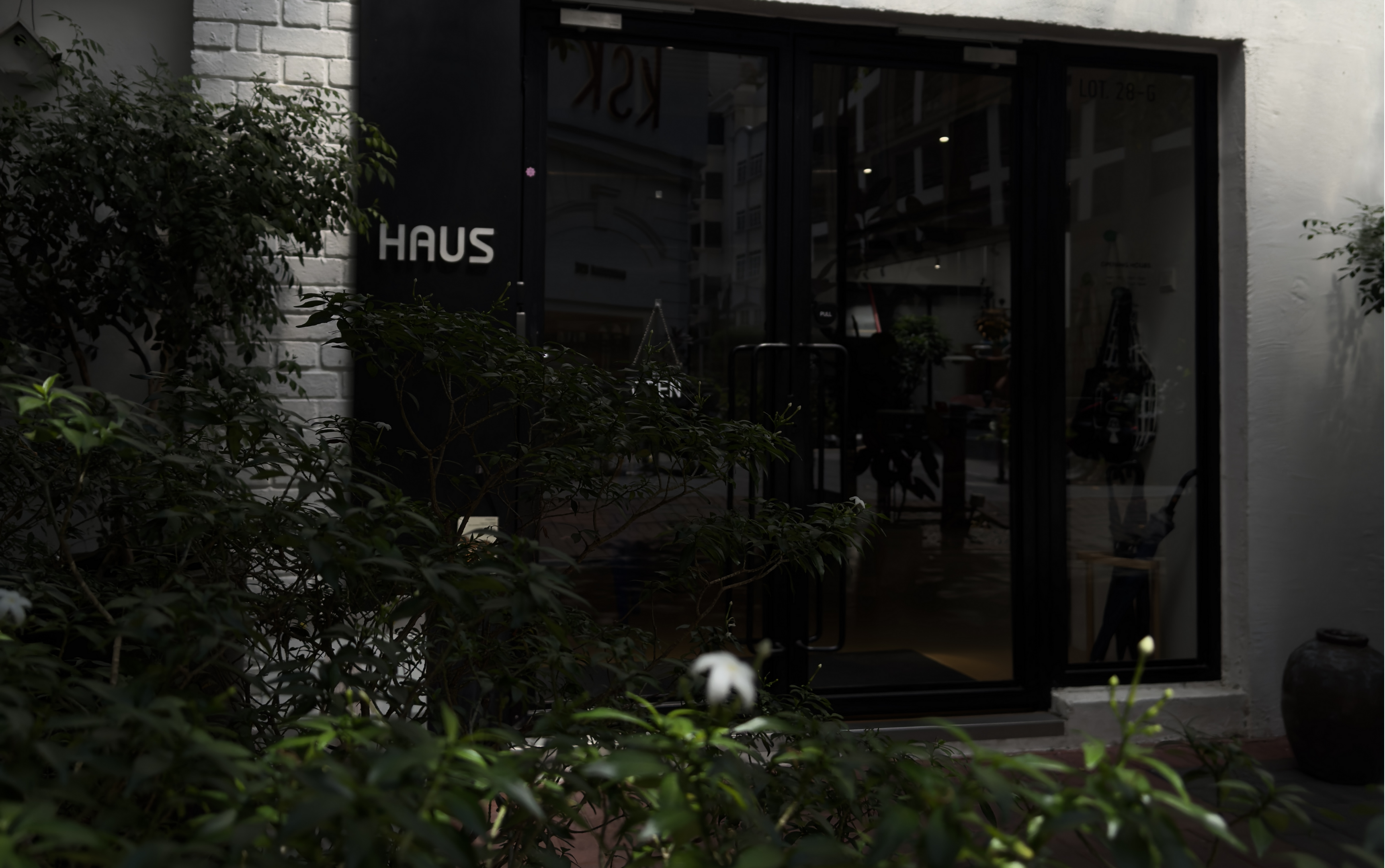 The entrance of the Haus showroom in Kuala Lumpur, Malaysia, featuring a sleek, minimalist design with black signage and a glass door. This image is optimized for local search results, helping customers in Malaysia find the physical store.